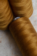 Ochre overlock bobbin x 4