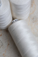 Off-white overlock bobbin x 4