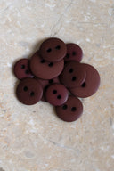 Another close-up of the buttons on the marbled beige stone, from a different angle.