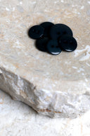 Another close-up of the buttons on the marbled beige stone, from a different angle.