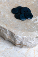Another close-up of the buttons on the marbled beige stone, from a different angle.