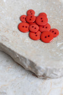 Another close-up of the buttons on the marbled beige stone, from a different angle.