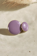 Close-up of the faceted buttons, showing the gold trim and the metal shank fastening on the back.