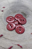 Close-up of the fully glittered buttons, highlighting the sparkling texture of the finish.