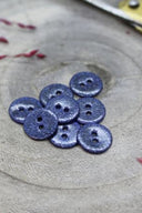 Close-up of the fully glittered buttons, highlighting the sparkling texture of the finish.