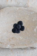 Another close-up of the buttons on the marbled beige stone, from a different angle.