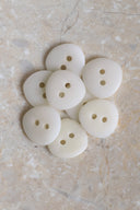 Another close-up of the buttons on the marbled beige stone, from a different angle.
