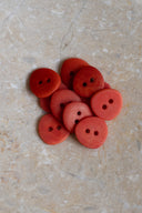 Another close-up of the buttons on the marbled beige stone, from a different angle.