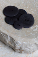 Another close-up of the buttons on the marbled beige stone, from a different angle.