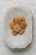 Another close-up of the buttons on the marbled beige stone, from a different angle.