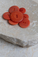 Another close-up of the buttons on the marbled beige stone, from a different angle.