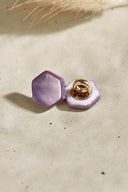 Close-up of the buttons shown from the back, revealing the gold metal shank fastening.