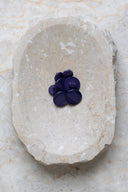 Another close-up view of the buttons on the marbled beige stone, from a different angle.