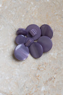 Another close-up view of the buttons on the marbled beige stone, from a different angle.