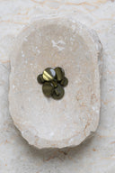 Another close-up of the buttons on the marbled beige stone, from a different angle.