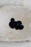 Close-up of the same buttons on the edge of a marbled beige stone.