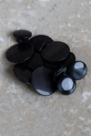 Another close-up view of the buttons on the marbled beige stone, from a different angle.