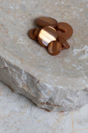 Another close-up of the buttons on the marbled beige stone, from a different angle.