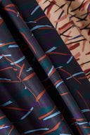 Close-up of the folds of the Fuji fabric, juxtaposing the powder pink Blush colorway and the dark Night colorway.