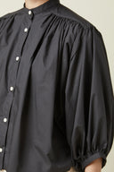 Blouse pattern – front view, blouse black gathered, officer collar, puff sleeves, white buttons – Atelier Brunette