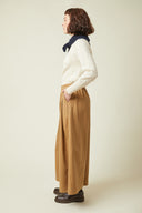 Culotte Skirt pattern – left profile view, culotte skirt camel, cream jumper, navy scarf – Atelier Brunette