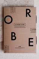 Flare Dress pattern – kraft envelope printed with dress FLARE, Atelier Brunette logo, marble background – Atelier Brunette