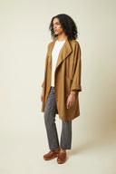 Troublante Jacket pattern – front view 3/4, colourway caramel worn with grey jeans – Atelier Brunette