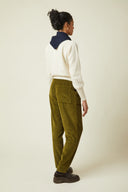 Carrot Trousers pattern – Profile view, trousers corduroy khaki olive, cream jumper, navy scarf – Atelier Brunette