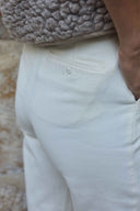 Trousers pattern – detail back, fabric ivory textured, piped pocket and button closure – Atelier Brunette