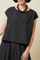 Top Encolure sewing pattern – half-body portrait, colourway black with a necklace – Atelier Brunette