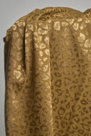 Close-up of the Leony viscose jacquard fabric with a camel and gold leopard print.