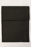 La Rayure 002 charcoal fabric with fine ecru stripes, folded in half and viewed from above.