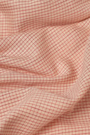 Tissu Le Carreau 010 rose poudré à fin quadrillage tissé ton sur ton, plié à plat.