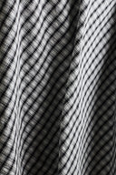 Close-up of the crinkled folds of the charcoal seersucker fabric, detailing the raised puckered texture unique to seersucker.
