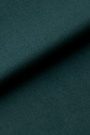 Pine green cotton poplin fabric folded diagonally, showing off its fine grain.