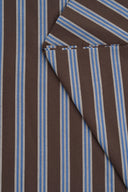 Weave Line chocolate brown fabric with sky-blue stripes, folded to a point with its fringed selvedge showing.